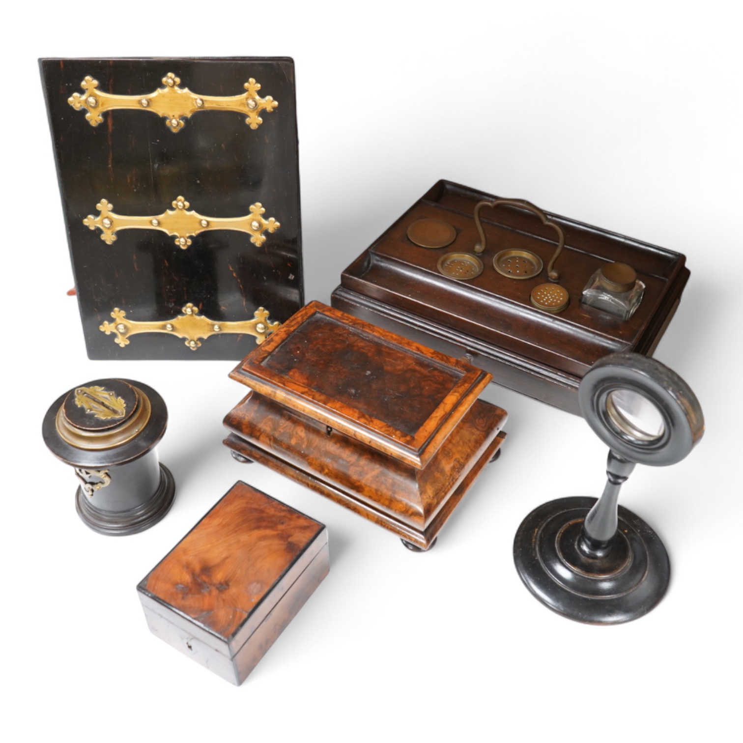 A collection of sundry items to include a Coromandel and brass mounted ink blotter pad, an early 19th century French yew veneered travelling writing box, an early 19th century mahogany desk stand and burr walnut bombé sh
